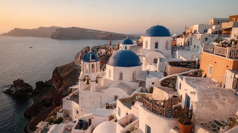 Oia: Santorini's iconic sunset village above Ammoudi Bay